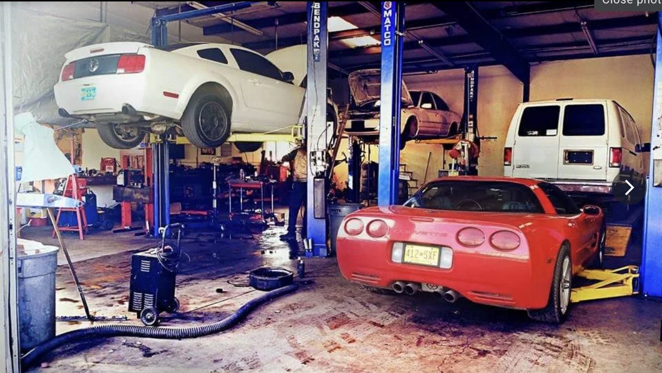 Vehicles raised on BendPak lifts inside Rafa's Auto Repair, Santa Fe